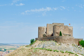 Fototapeta na wymiar Middle age castle of La Muela on a hill in Consuegra, Toledo, Spain. Defense historical tower.