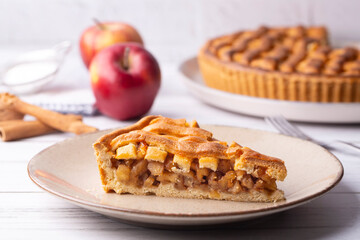 Homemade Apple Pies on a white wooden background, top view. The classic fall Thanksgiving dessert - organic apple pie. (Turkish name; elmali turta)