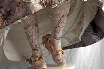 details of fallero costume slippers, espardeñas and tights, one foot on the toe