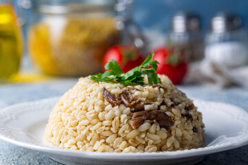 Turkish foods; Bulgur pilaf with mushrooms (Turkish name; mantarli bulgur pilavi)