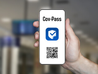 Stuttgart,Baden W&uuml;rttemberg , Germany-2021 Vaccination passport application. a phone in hand and the covpass app on its screen . vaccination passport for travel . 3d illustration