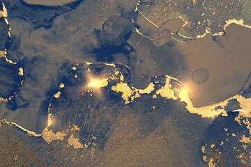 Dark blue and gold abstract marble pattern with sparkles. Vector background in alcohol ink technique with glitter. Template for banner, poster design. Fluid art painting