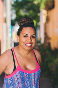 aussie aboriginal woman, smiling to camera
