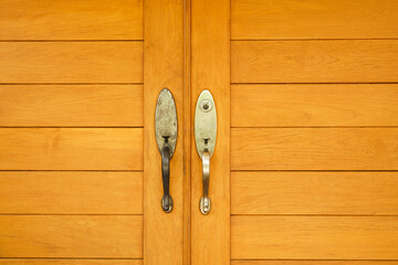 stainless door knob or handle on wooden door