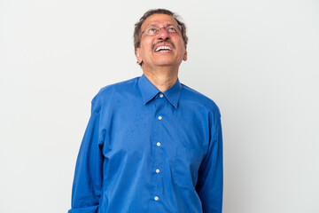 Middle aged indian man isolated on white background shouting very angry, rage concept, frustrated.