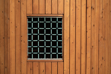 Obraz na płótnie Canvas blue-green window in a wooden house