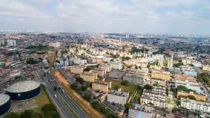 Fototapeta na wymiar Aerial view of Itaquera, Sao Paulo. Residential buildings, avenues and train