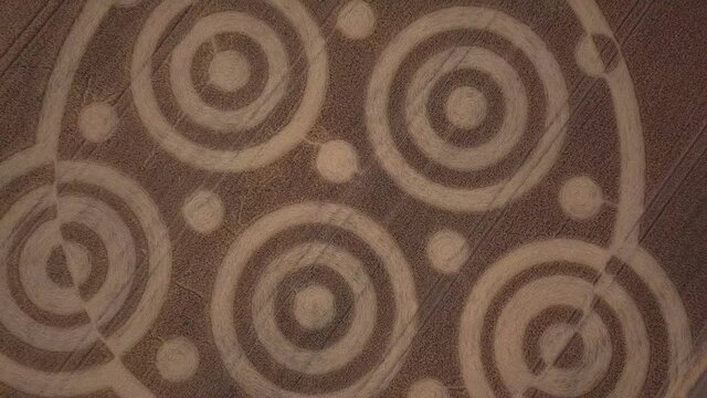 Crop circle in middle of field below Pewsey Downs near Avebury. Wiltshire. England (aerial photography)