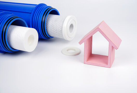 Blue housing water purifier pre-filter and cartridge. Changing the water filter of new. model house.