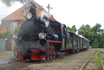 Fototapeta na wymiar Old steam locomotive move on the rail