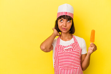 Young mixed race ice cream maker woman holding an ice cream isolated on yellow background touching back of head, thinking and making a choice.