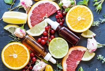 Serum set in glass cosmetic bottles with natural hyaluronic acid and vitamin C for the care of...