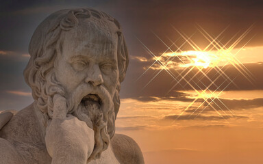 Socrates the ancient Greek philosopher statue and dramatic sundown, Athens Greece