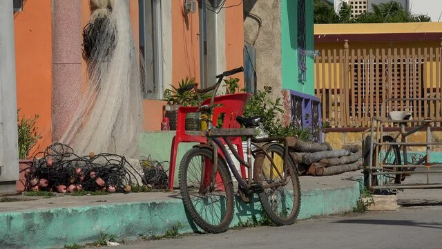 Fishing nets and old bicycle in front of a fisherman house. Rio Lagartos, Yucatan, Mexico