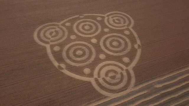 Crop circle in middle of field below Pewsey Downs near Avebury. Wiltshire. England (aerial photography)