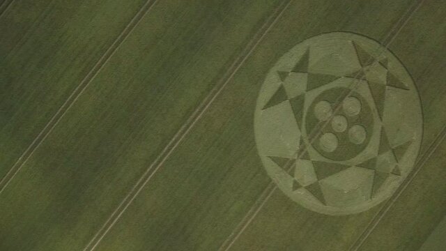 Crop circle in middle of field below Pewsey Downs near Avebury. Wiltshire. England (aerial photography)