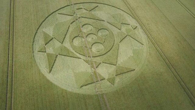Crop circle in middle of field below Pewsey Downs near Avebury. Wiltshire. England (aerial photography)