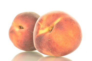 Two ripe organic peaches, close-up, isolated on white.