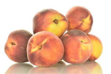 Several ripe organic peaches, close-up, isolated on white.