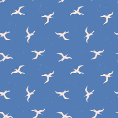 Seamless pattern with white birds on bluebackground. Silhouettes of seagulls flying in the sky. Vector colored endless texture for your designs packing, cards, wrapping paper, textile, towels