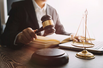 justice and law concept.Male judge in a courtroom on wooden table and Counselor or Male lawyer...