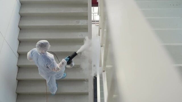 sanitizing fog machine for disinfecting railings in building
