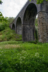 Fototapeta na wymiar Monsal Viaduct in Derbyshire's Peak District. A disused former railway bridge that now forms part of the Monsal Dale walkingcycle route
