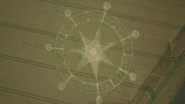 Crop circle in middle of field below Pewsey Downs near Avebury. Wiltshire. England (aerial photography)