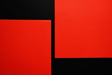 Sheets of red paper on black background