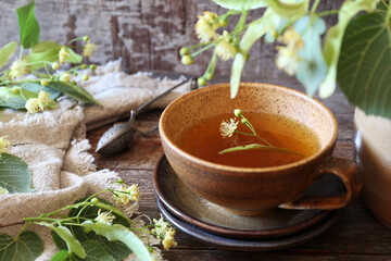 Cup of herbal tea with linden flowers