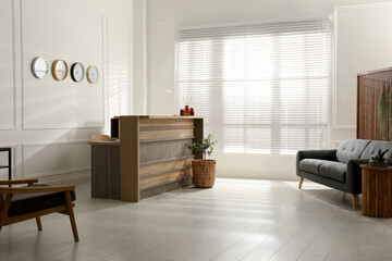 Hotel lobby interior with wooden reception desk. Stylish workplace