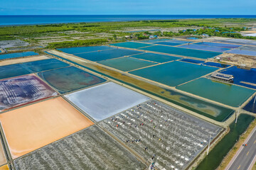 Phetchaburi Salt flats Naklua, farms and farmers collecting salt in Phetchaburi, Thailand