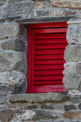 Red Louvered Window in an Old Stone Wall, Ireland