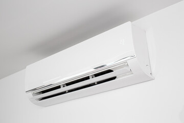 Domestic Indoor Air conditioner unit mounted on wall used for heating or cooling a space