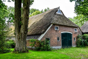 Fototapeta na wymiar Typical old Dutch farmhouse in rural Drenthe. Netherlands, Holland, Europe