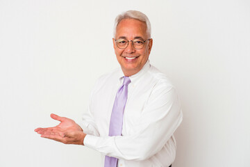 Senior american man isolated on white background holding a copy space on a palm.