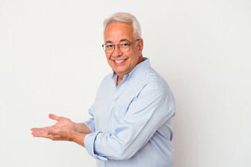 Senior american man isolated on white background holding a copy space on a palm.