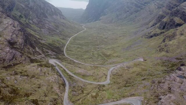 4k drone footage of the narrow winding mountain road at Bealach na Ba near Applecross in the Scottish Highlands, UK
