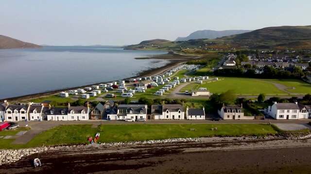 4k drone footage of the seafront at Ullapool in the Western Highlands of Scotland, UK