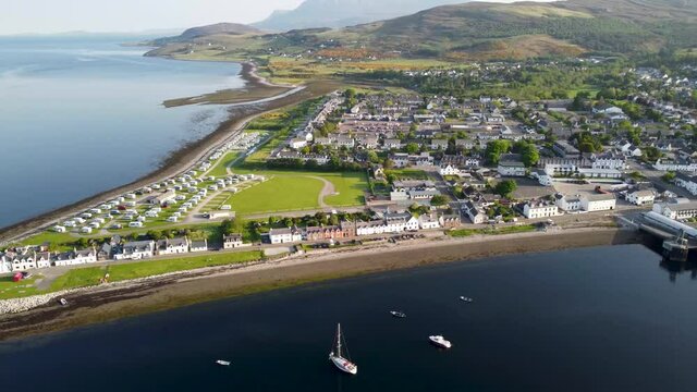 4k drone footage of the seafront at Ullapool in the Western Highlands of Scotland, UK