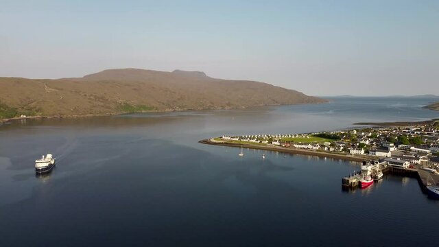 4k drone footage of the seafront at Ullapool in the Western Highlands of Scotland, UK