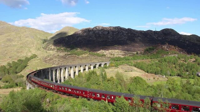 4k footage of the Jacobite Steam Train crossing the Glenfinnan Viaduct near Fort William in the Scottish Highlands, UK