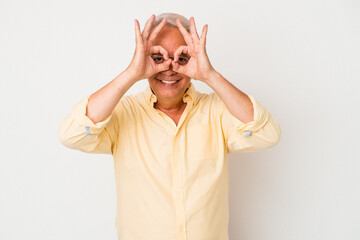 Senior american man isolated on white background excited keeping ok gesture on eye.