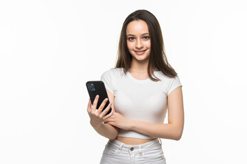 Fototapeta premium Woman using a mobile phone isolated on a white background