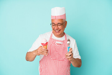 Senior american ice cream maker holding an ice cream isolated on blue background