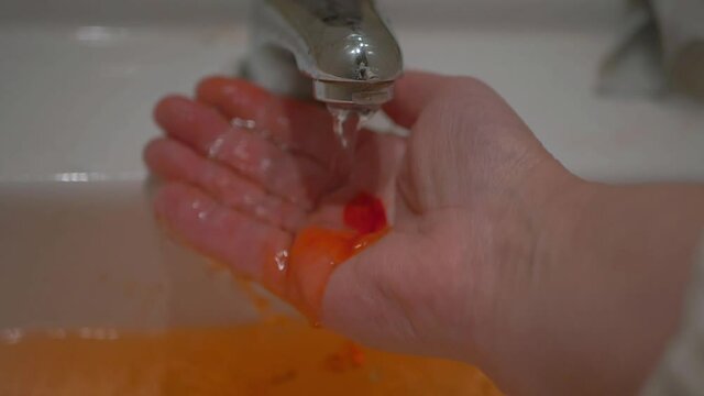 Cleaning bleeding hand after accident in sink