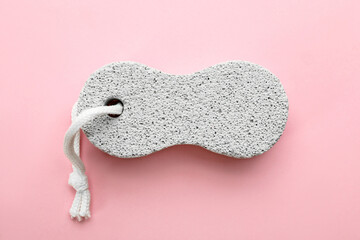 White pumice stone on pink background, top view