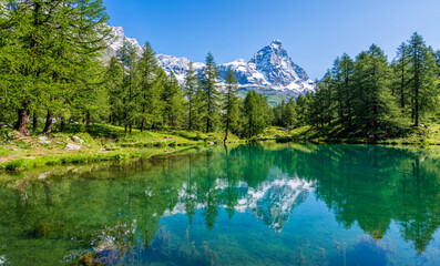 Idyllic morning view at the Blue Lake with the Matterhorn reflecting on the water, Valtournenche,...