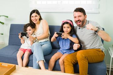 Mom and dad enjoying video games with their kids