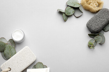 Flat lay composition with pumice stones on light grey background. Space for text